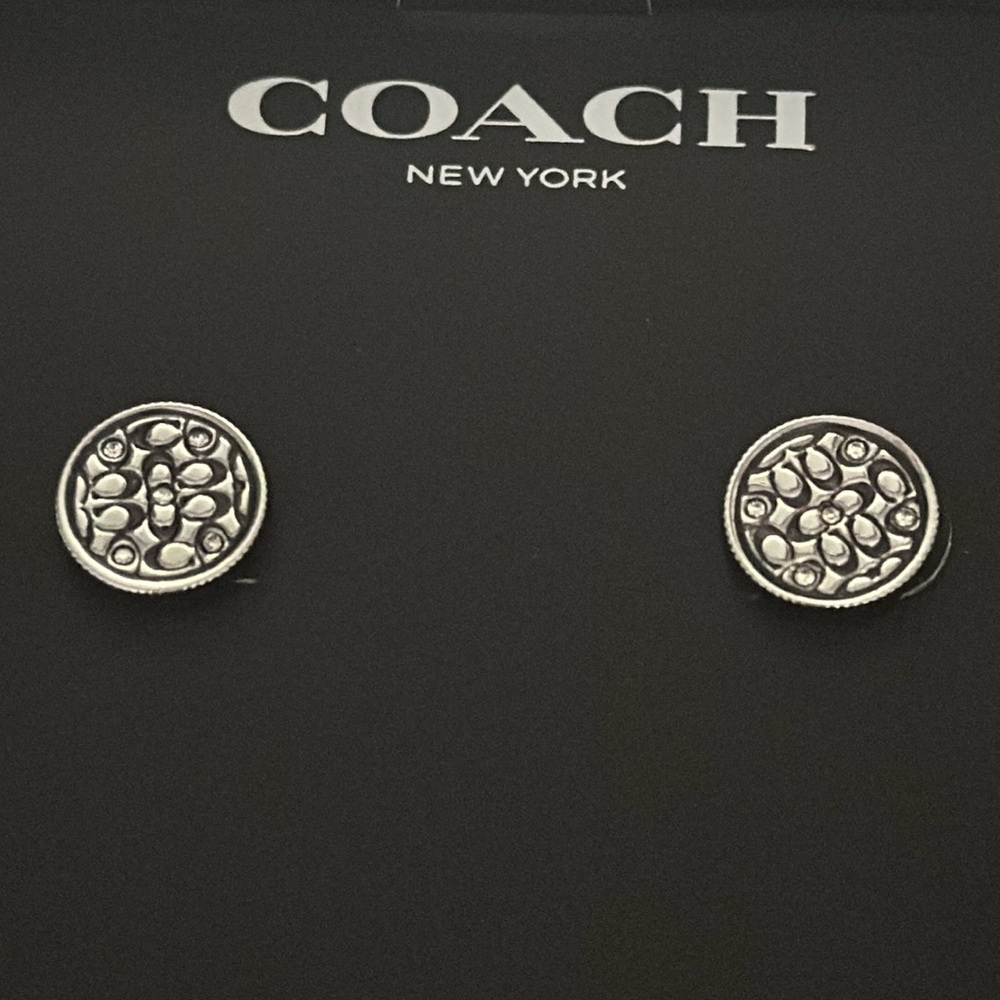 Coach silver quilted earrings.